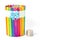 The invention and decoration Piggy bank from colorful popsicle sticks on white background.