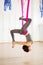 Inversion pigeon pose in aero anti gravity yoga. Aerial exercises