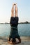 Inversion pose near lake by yoga master