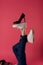 inverted foot black shoe fashion modern style pink background