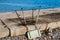 Inverted rusty chair by the sea