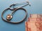 investment in health care, Brazilian money and stethoscope for medical check