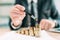 Investment return concept, businessman pointing to a coin stack at office desk