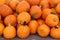 Inviting background of bright orange pumpkins on table at farmers market