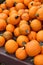 Inviting background of bright orange pumpkins on table at farmers market