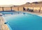 Inviting blue swimming pool in a wooden deck