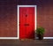 Inviting red front door with welcome mat