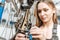 Involved female mechanic fixing the chain in the repair shop