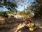 Inwa, Myanmar - The man on a motorcycle doing agricultural work.