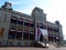 Iolani Palace covered in Hawaii State and Hawaiian Kingdom Flags