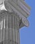 Ionian order column detail, blue sky background