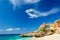 Ionian sea coast landscape with sandy beach and rock