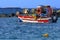 Ionian Sea - Zakynthos Island, landmark attraction in Greece. Fishing boat surrounded by rocks. Seascape