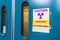 Ionizing radiation warning symbol displayed at the entrance to a laboratory; Message posted: