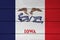 Iowa flag color painted on Fiber cement sheet wall background, vertical tricolor of blue white and red and the image of a bald