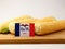 Iowa flag on a wooden panel with corn isolated on a white backgr