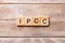 IPCC word written on wood block. abbreviation Intergovernmental Panel on Climate Change text on wooden table for your desing,
