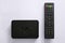 Iptv box and remote controller. Modern multimedia device for viewing television via the Internet, multimedia player and control