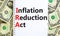 IRA inflation reduction act symbol. Concept words IRA inflation reduction act on white note on a beautiful background from dollar