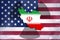 Iran American tension concept. The country of Iran with the radioactive symbol and American flag behind