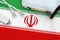 Iran flag depicted on table with internet rj45 cable, wireless usb wifi adapter and router. Internet connection concept