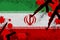 Iran flag and guns in red blood. Concept for terror attack and military operations