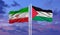 Iran and Palestine two flags on flagpoles and blue cloudy sky