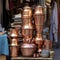 iran stack of copper kettles outside store