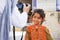 Iran, Yazd, old city - September 19, 2016: European tourist photographs a local Iranian girl in a national costume on the street.