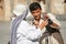 Iran, Yazd, old town - September 19, 2016: Local man communicates with foreign tourists outdoors