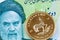 Iranian 10000 rial bank note with a close up image of a South African Krugerrand coin