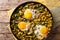 Iranian Baghali Ghatogh stew of beans and dill with fried eggs,
