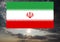 The Iranian flag against thunder clouds.