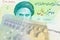 An Iranian rial bill with European money