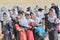 Iranian schoolgirls waiting to start the tour around museum, Shiraz.