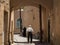 Iranian seniors, one old man and one old woman, walking in one of the streets of the old town of Yazd