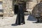 Iranian woman on a street in rock cones in Kandovan village. East Azerbaijan province. Iran