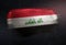 Iraq Flag Made of Metallic Brush Paint on Grunge Dark Wall