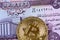 Iraqi fifty dinar note with a gold bitcoin