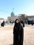 Iraqi woman wearing hijab standing outside the Tomb of Prophet Hud and Prophet Saleh in Karbala - Iraq travel