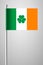 Ireland Flag with Shamrock. National Flag on Flagpole. Isolated