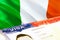 Ireland immigration document close up. Passport visa on Ireland flag. Ireland visitor visa in passport,3D rendering. Ireland multi