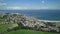 Ireland ocean bay town aerial view: port Ballycastle, Northern. Houses with cottages and city road