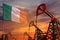 Ireland oil industry concept. Industrial illustration - Ireland flag and oil wells with the red and blue sunset or sunrise sky