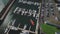 Ireland pier aerial view: ships, yachts, sails, motor boats on dark blue water with car park at port