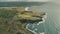 Ireland rural lands aerial: ocean cliff shoreline with wide green grass fields, vales, meadows