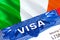 Ireland Visa in passport. USA immigration Visa for Ireland citizens focusing on word VISA. Travel Ireland visa in national