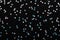 Iridescent Silver stars confetti on black Festive holiday background Glowing sparkles