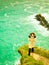 Irish atlantic coast. Woman tourist standing on rock cliff