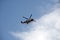 Irish coastguard helicopter in blue sky